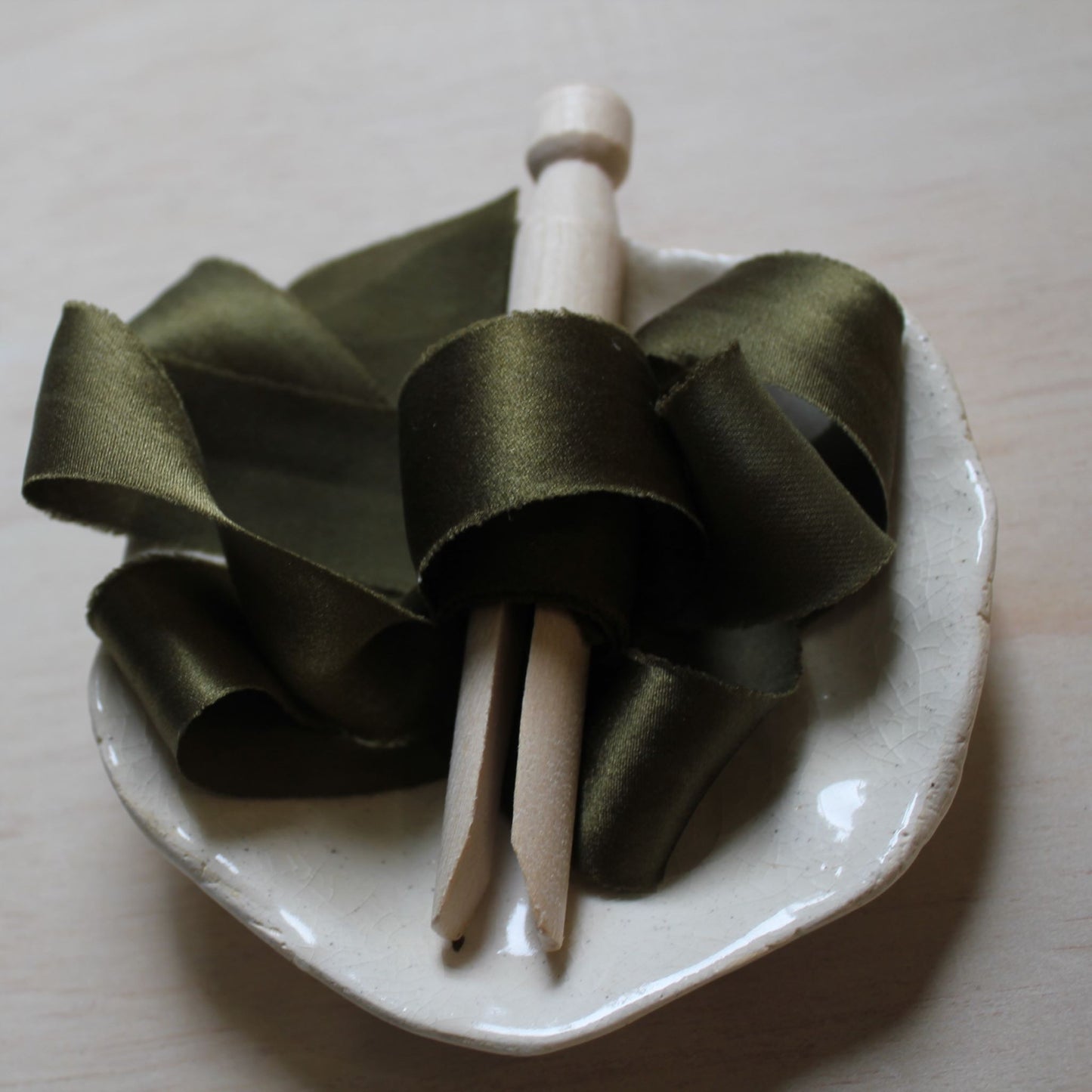 Canadian-dyed silk ribbon in deep moss tone