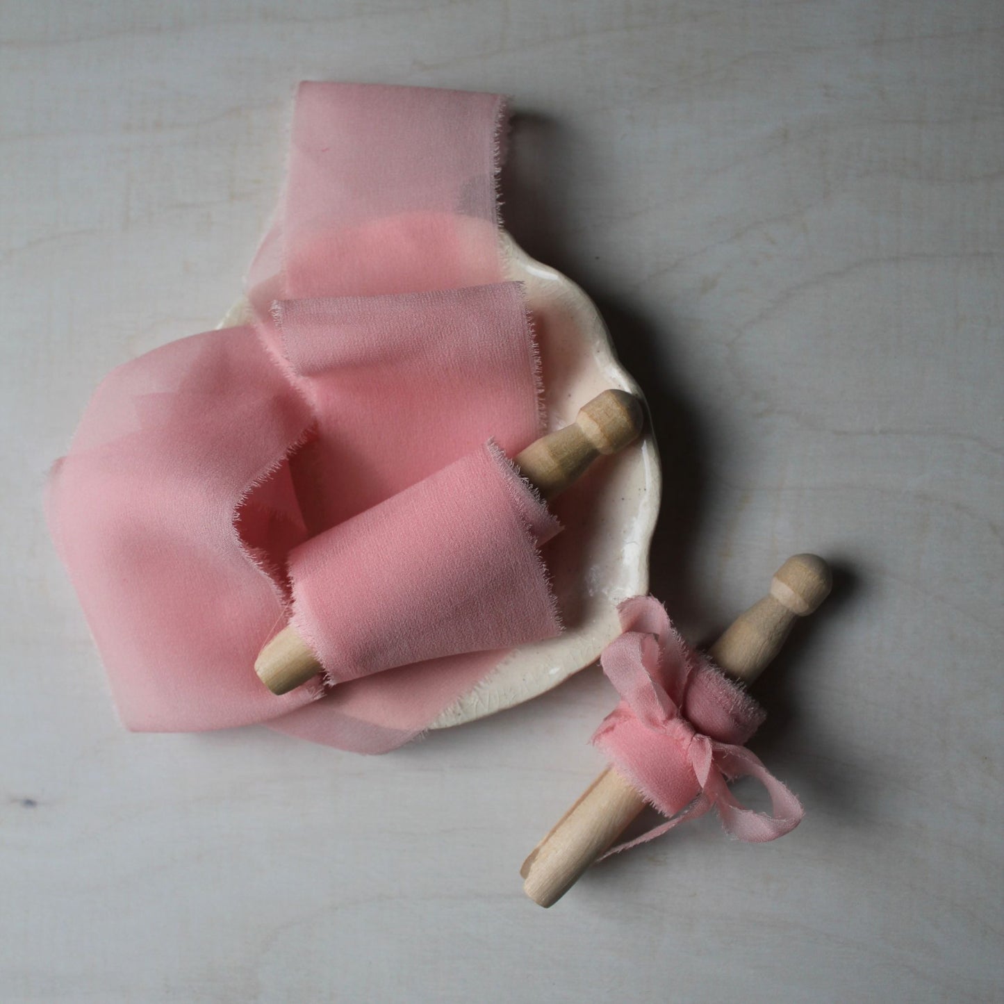 Elegant iridescent pink silk chiffon ribbon, hand-torn for a rustic yet refined touch to wedding bouquets and bridal accessories.