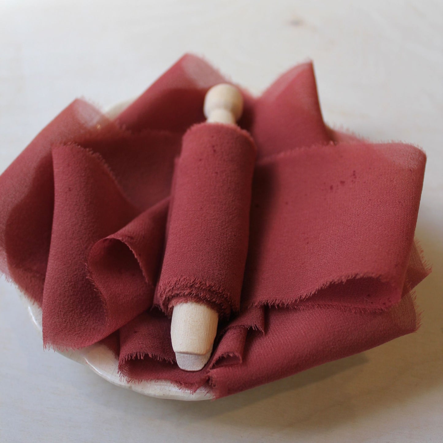 Handmade and naturally dyed red rust silk ribbon, crafted in Canada.