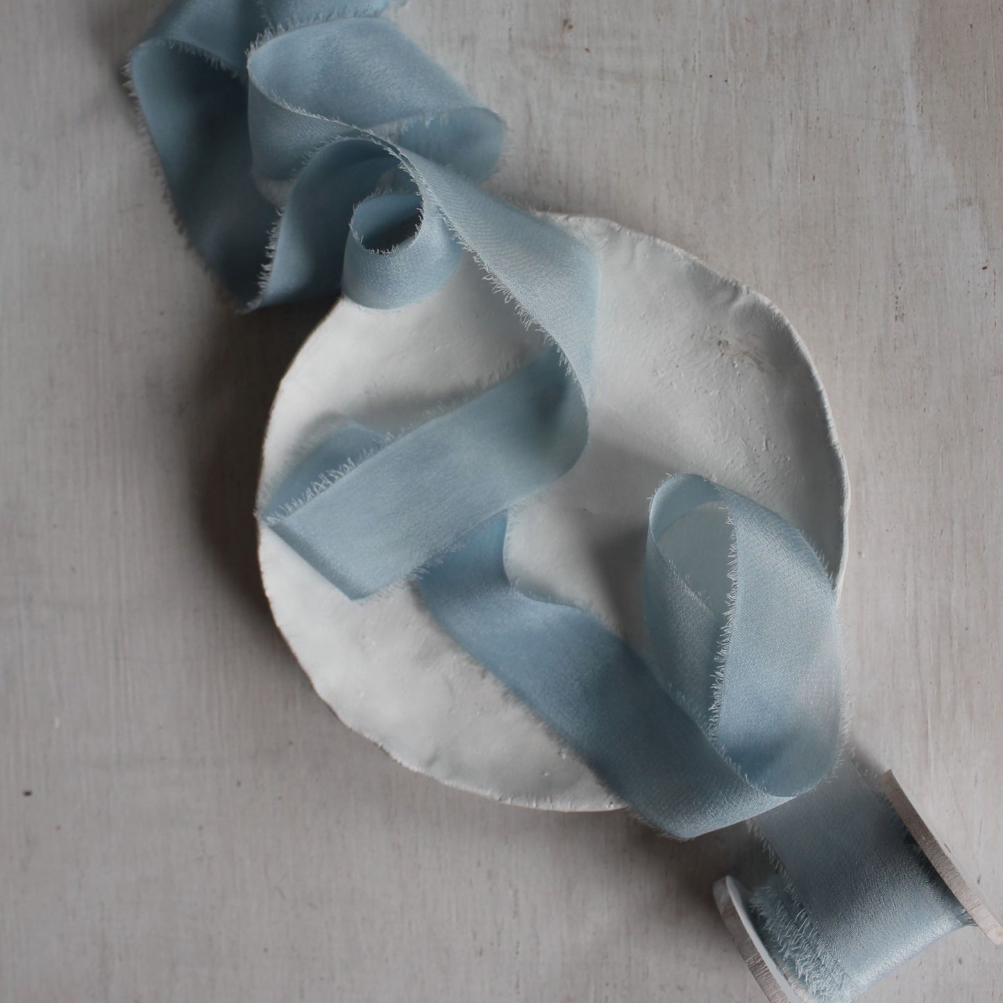 Crepe de chine ribbon in soft blue tones, perfect for invitations