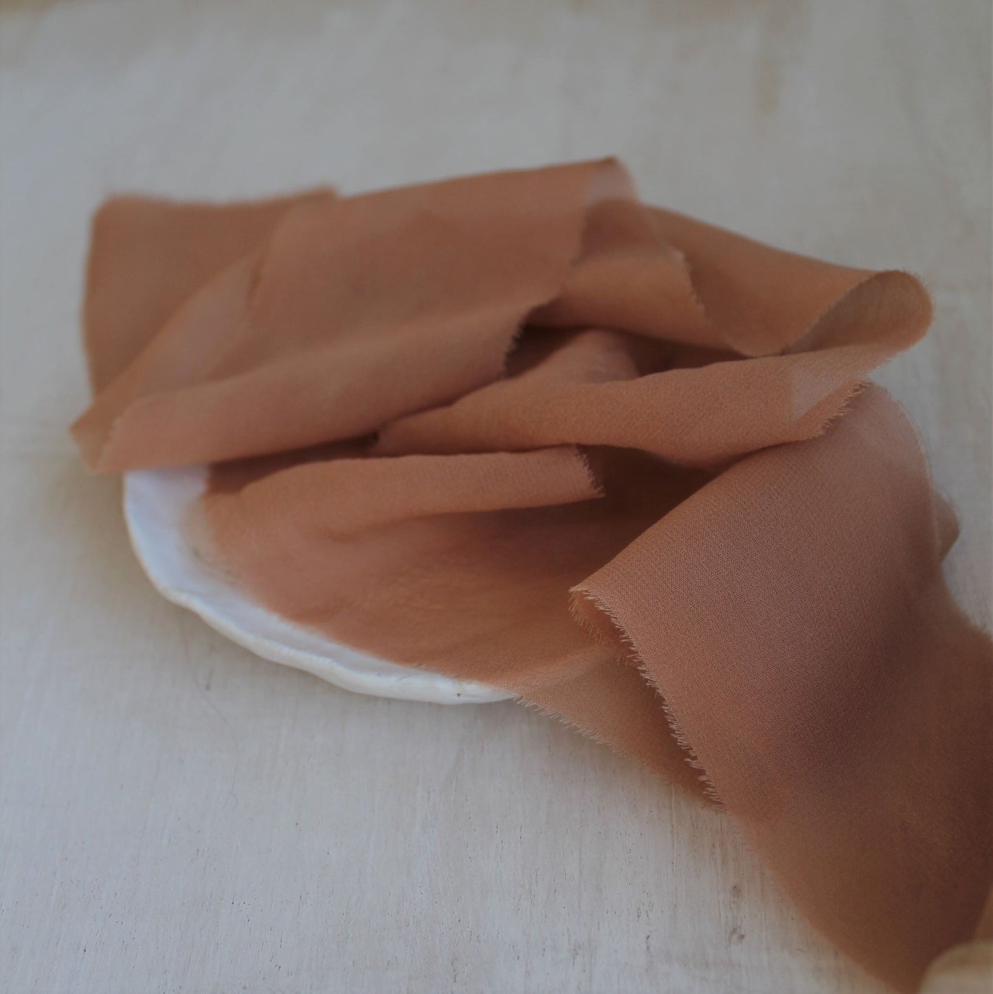Delicate feathered edges on hand-torn chiffon ribbon