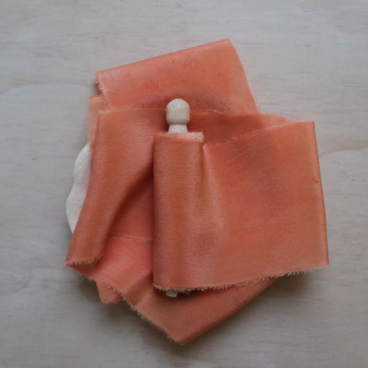 Bright pink silk crepe de chine ribbon hand torn with soft feathered edges and a slight sheen