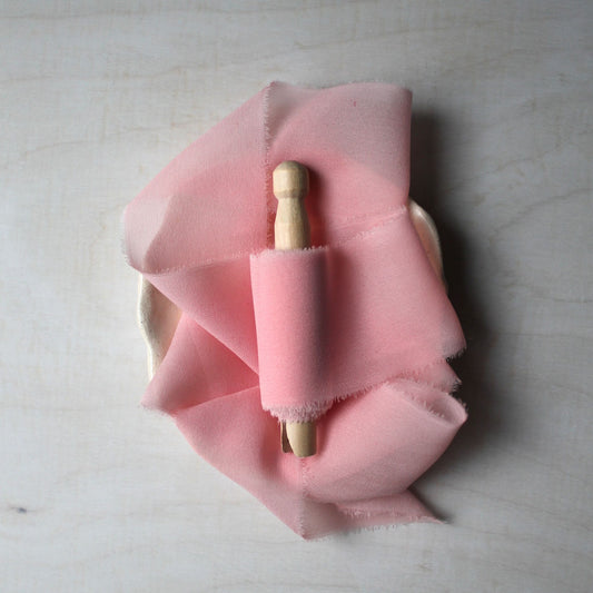 Iridescent pink silk chiffon ribbon, hand-torn with soft frayed edges, perfect for weddings and stationery.
