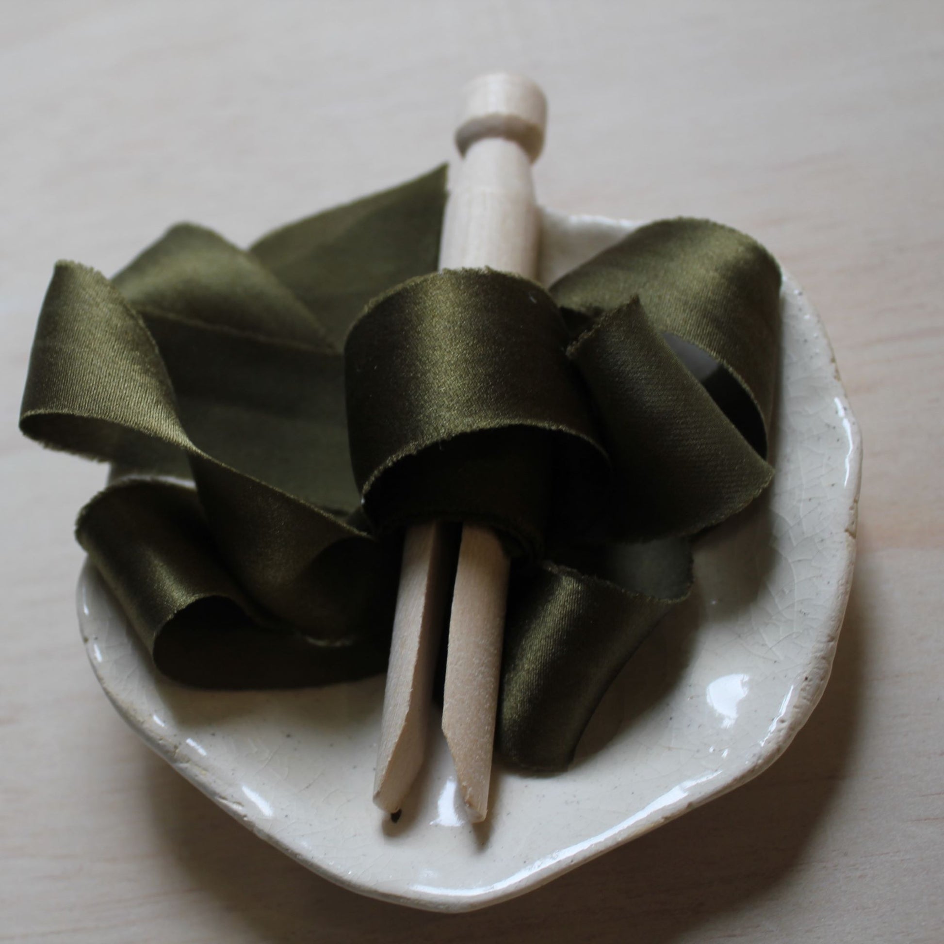 Canadian-dyed silk ribbon in deep moss tone