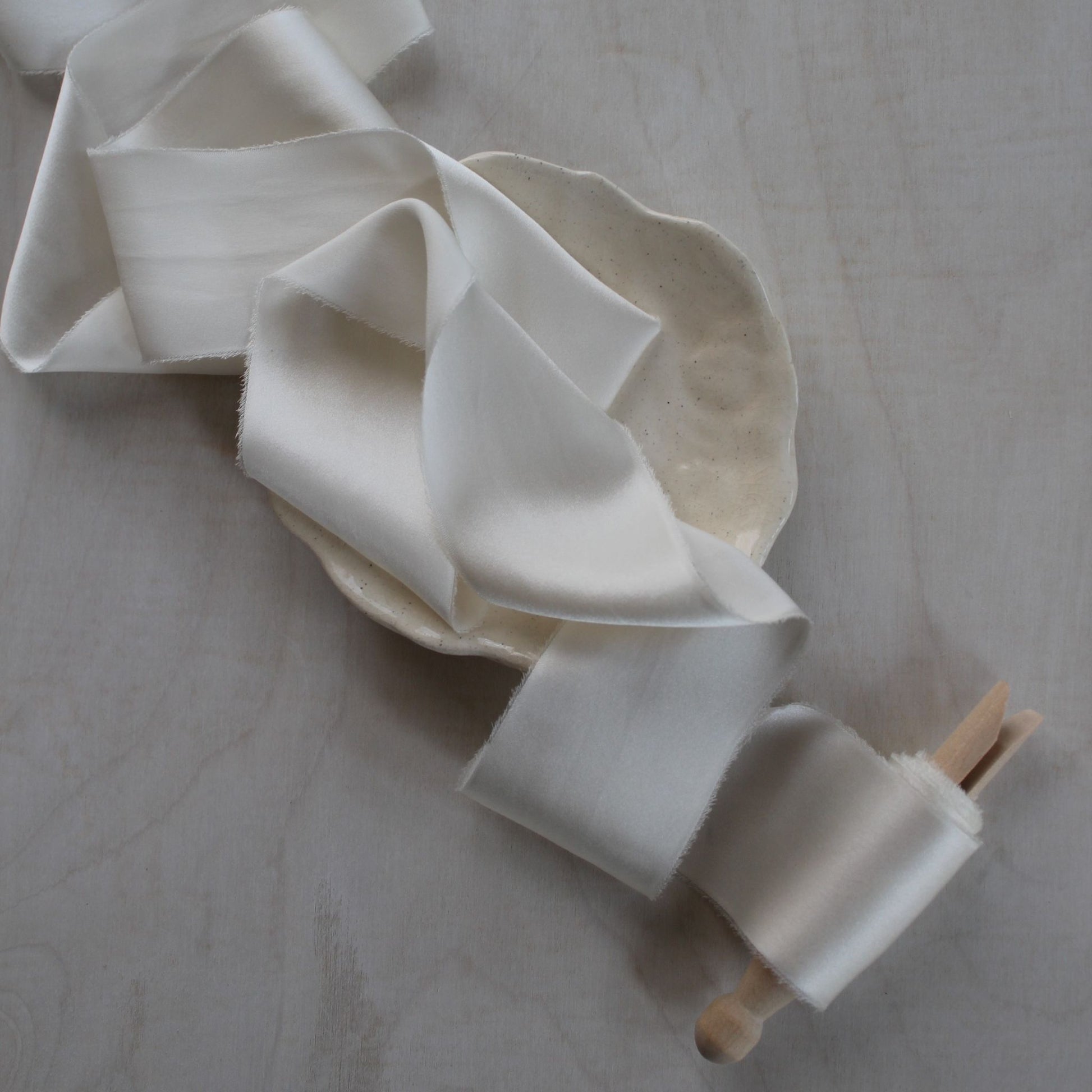 Elegant off-white charmeuse ribbon for wedding flat lays