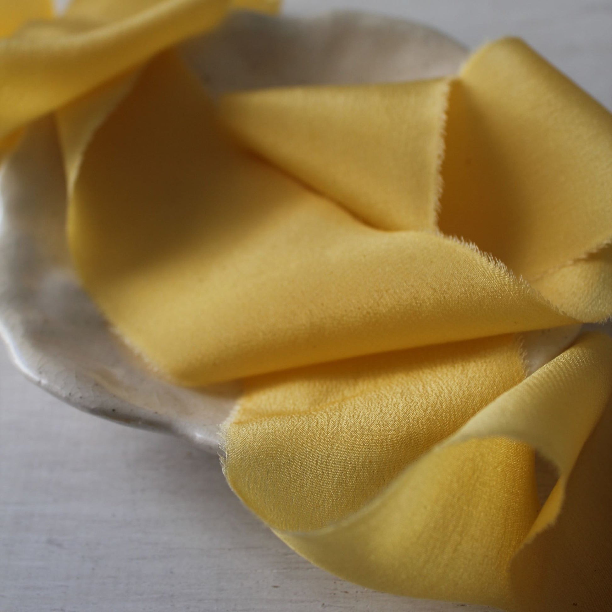 close up of yellow silk ribbon naturally dyed by hand in canada
