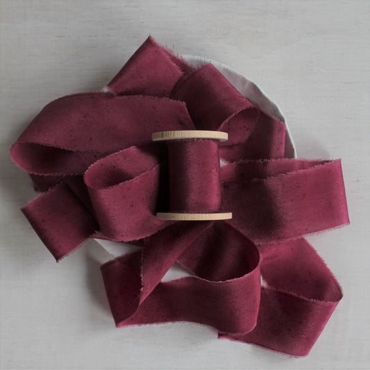 Hand-torn berry silk crepe de chine ribbon, perfect for weddings and stationery.