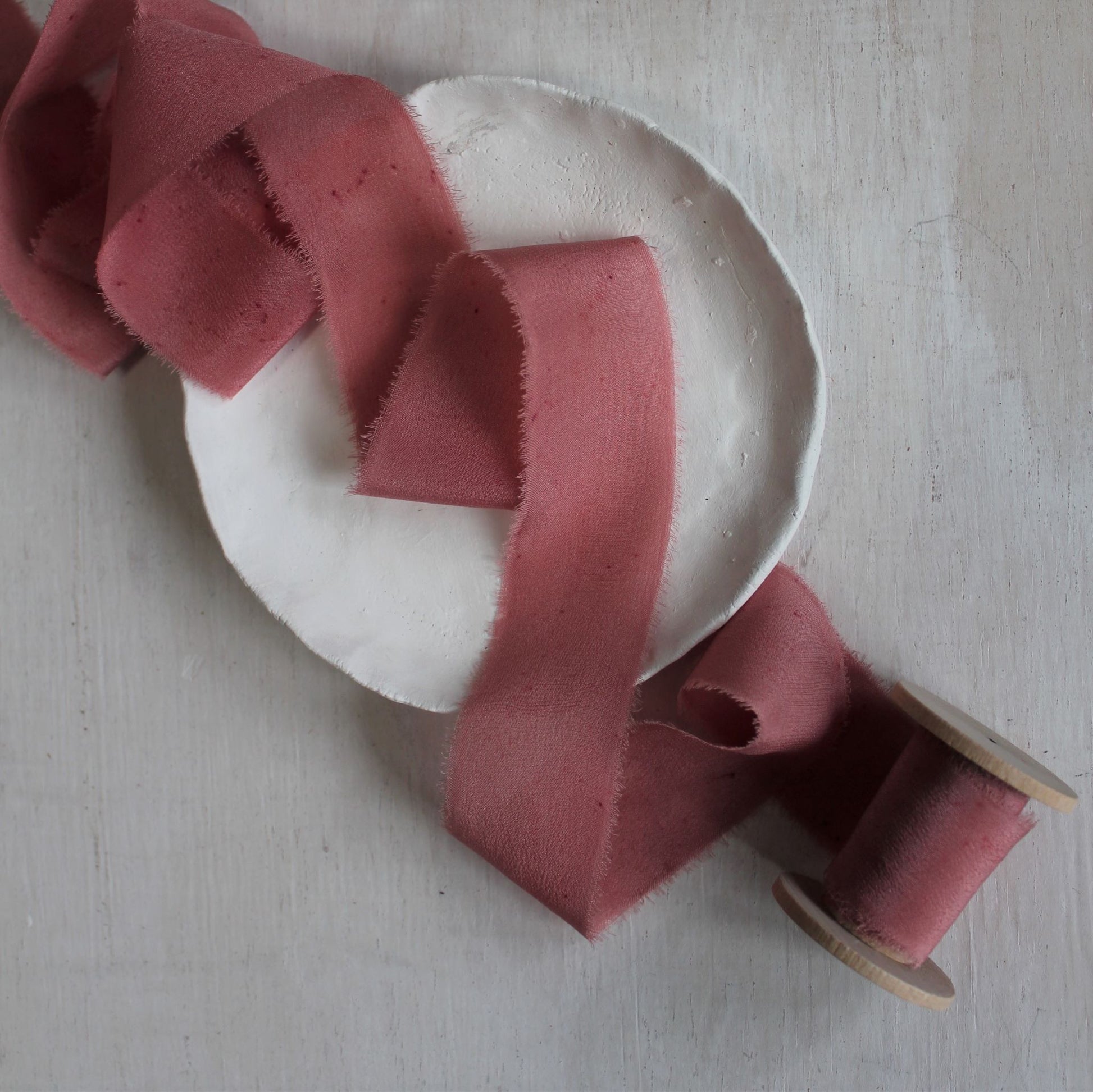Berry silk crepe de chine ribbon draped