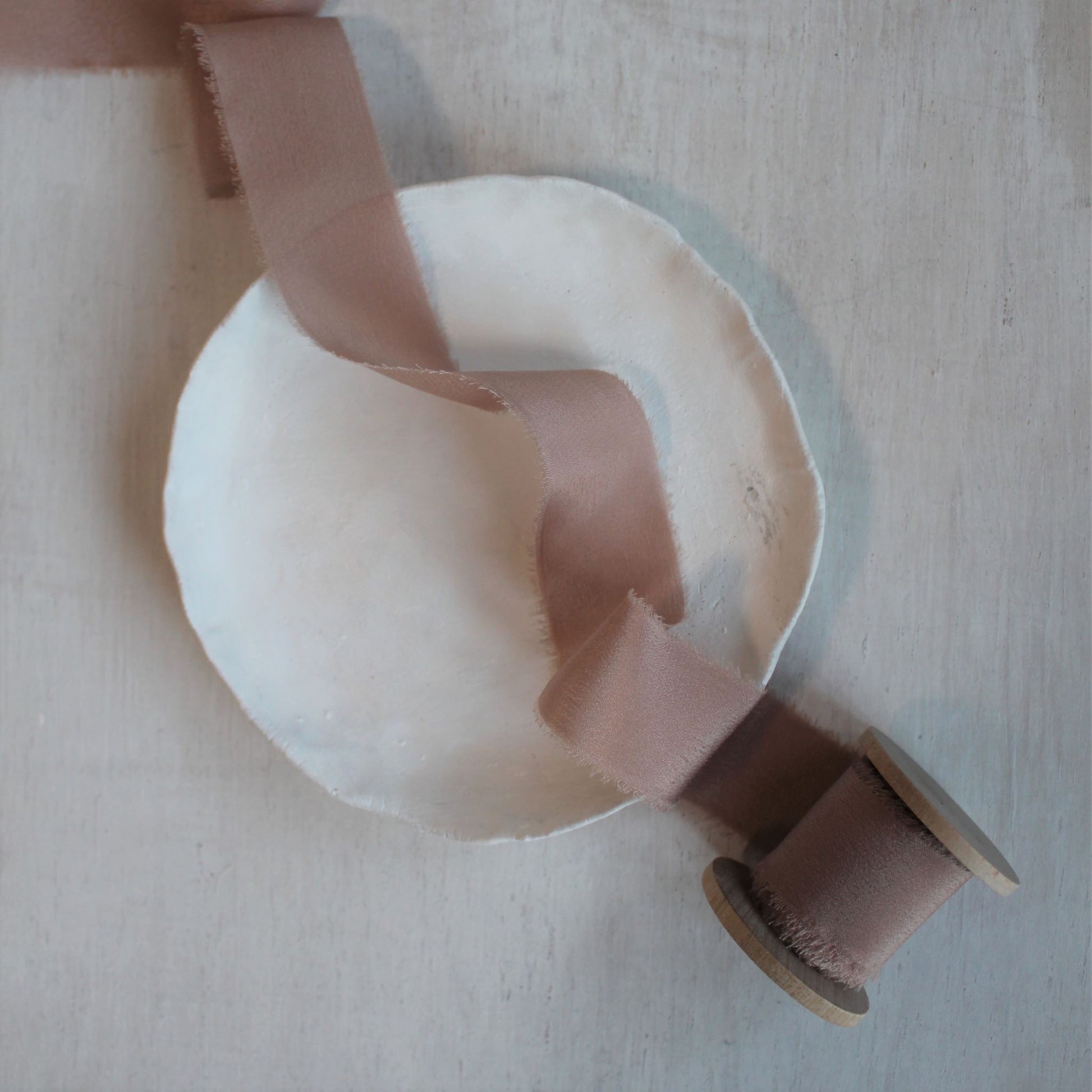 Dusty rose wedding ribbon on wood spool, handcrafted in Canada