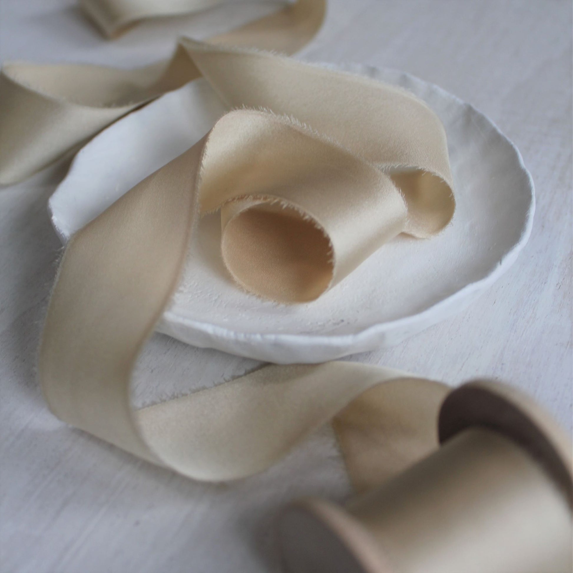 Maple silk charmeuse ribbon, hand-torn for a soft, elegant look, perfect for weddings and invitations