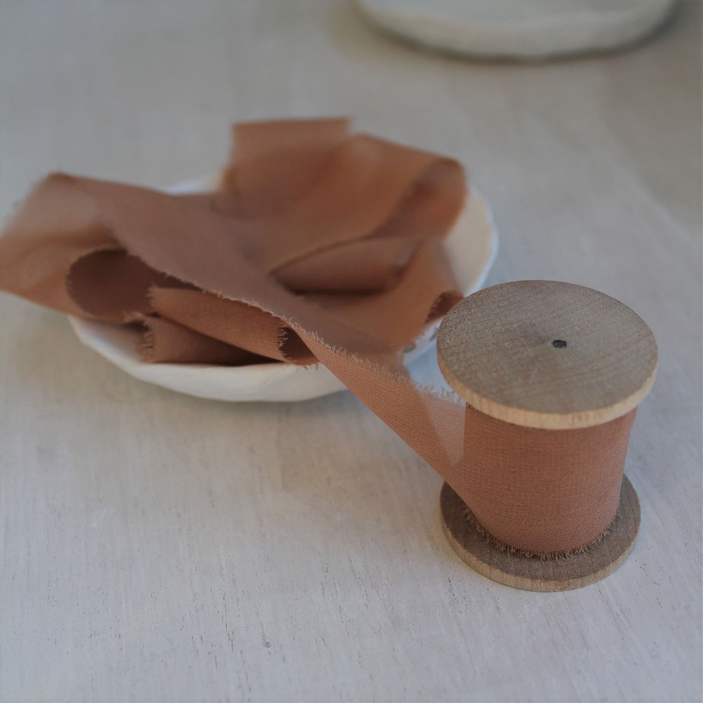Sheer terra cotta silk ribbon styled